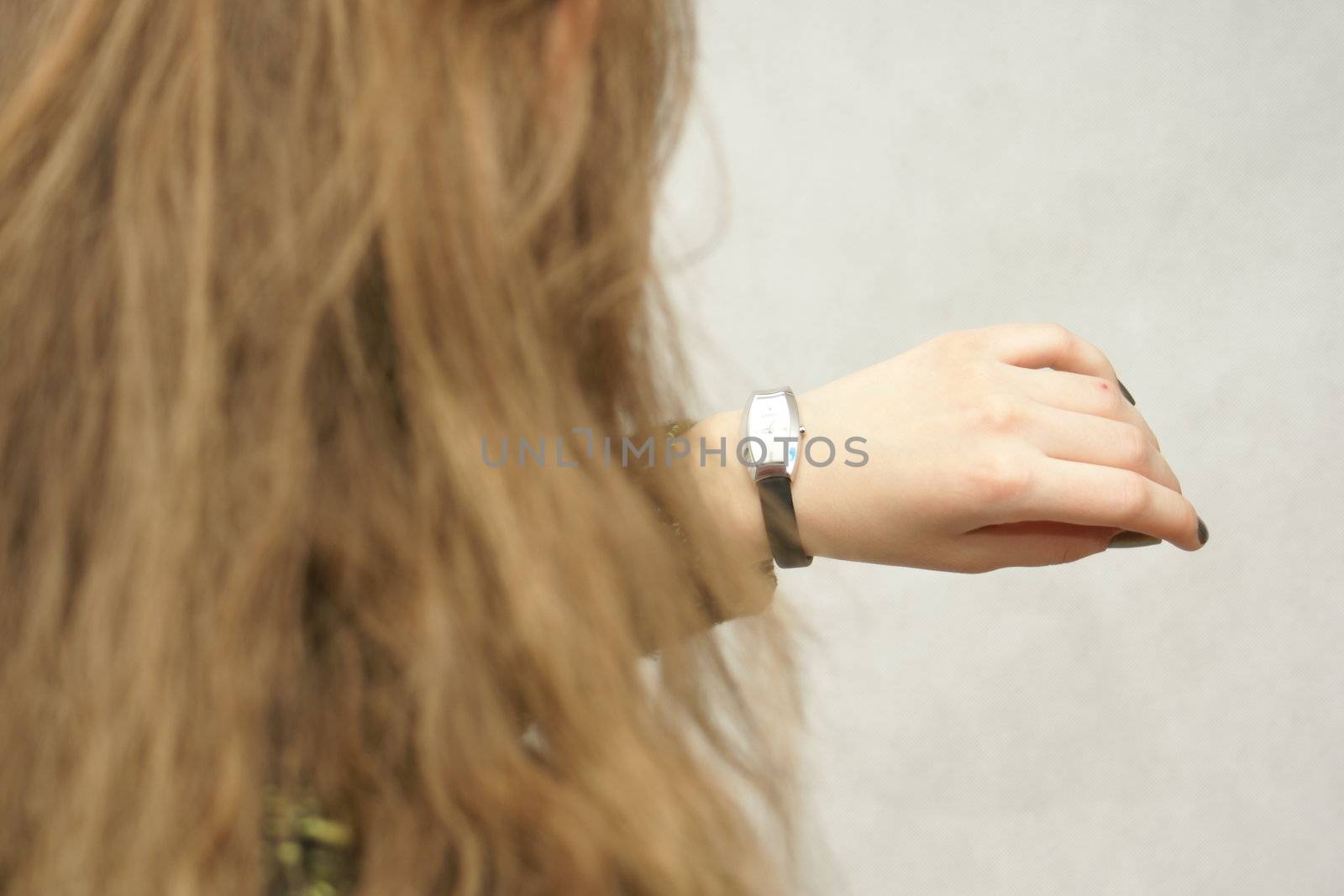Young beautifful gril from Poland with watch in isolated photo. Home Photo Studio Sony Alpha 700