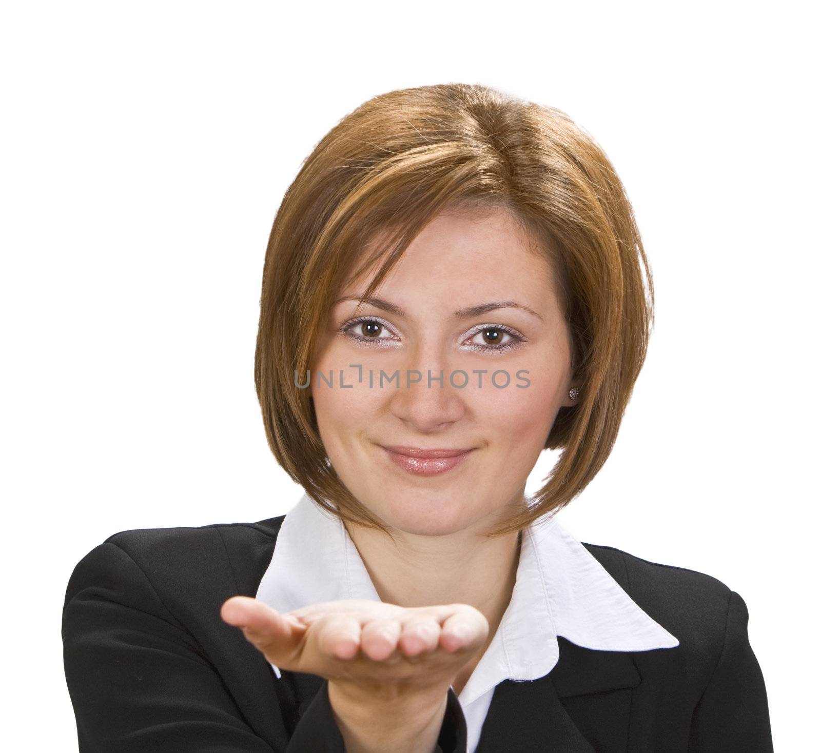 Smiling brunette offering something on her hand.Selective focus on the face.