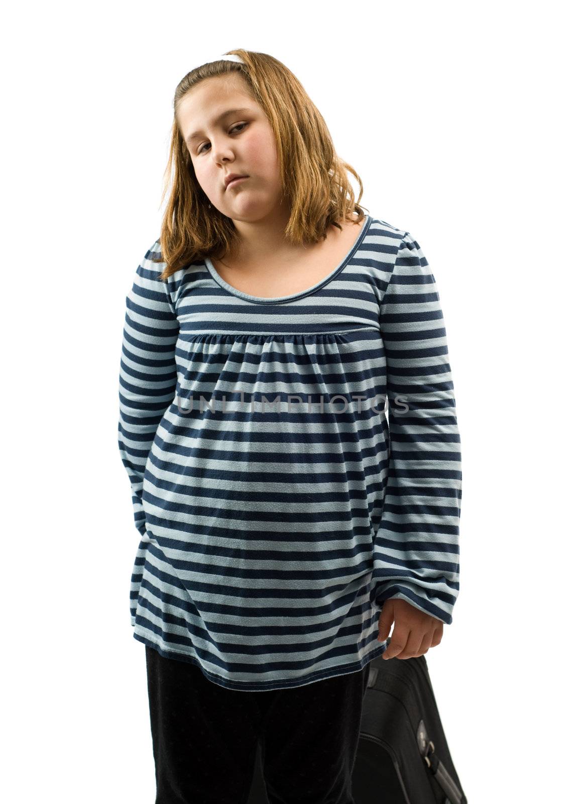 A young girl pulling her suitcase behind her, isolated against a white background