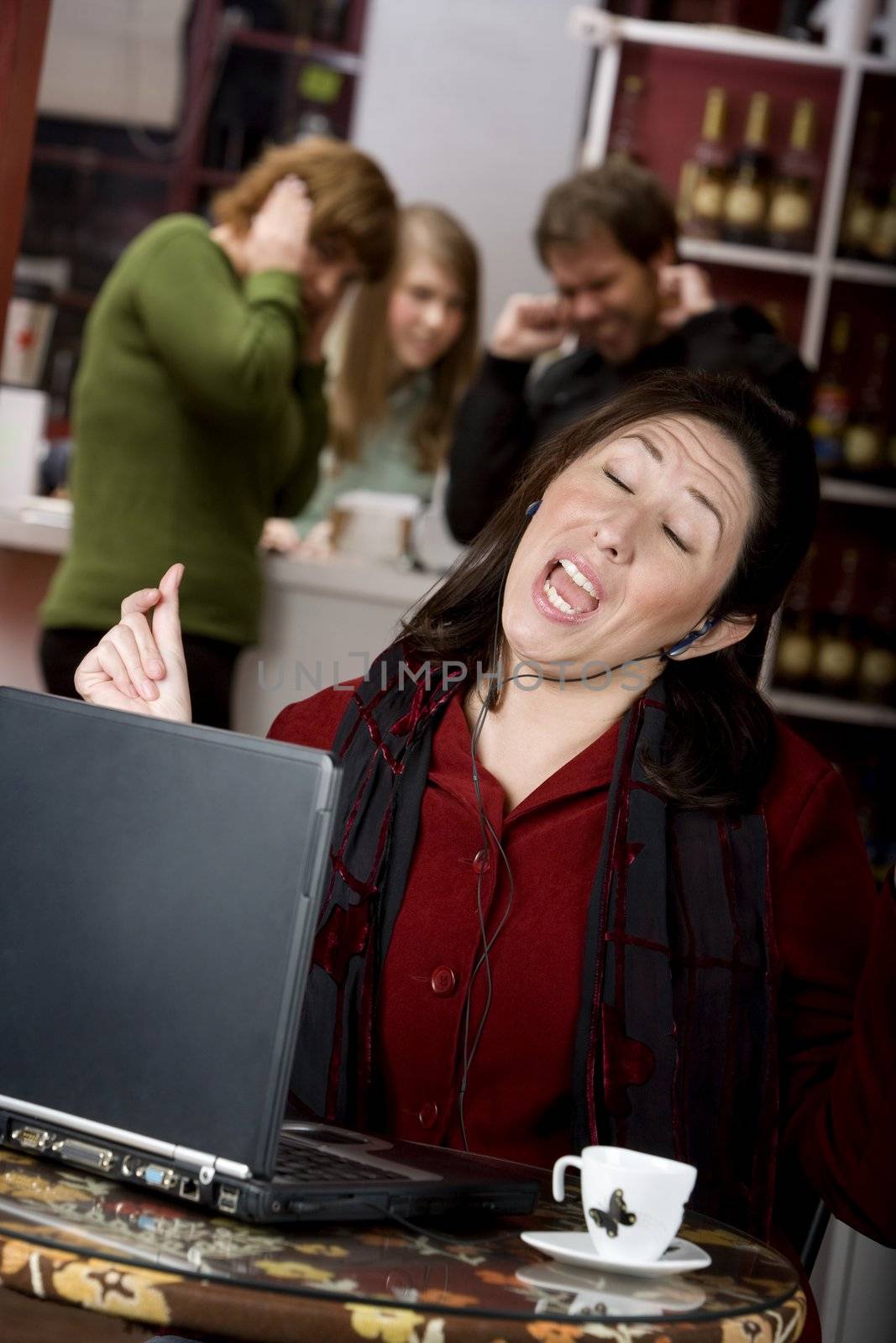 Obnoxious young woman singing loudly in a coffee house