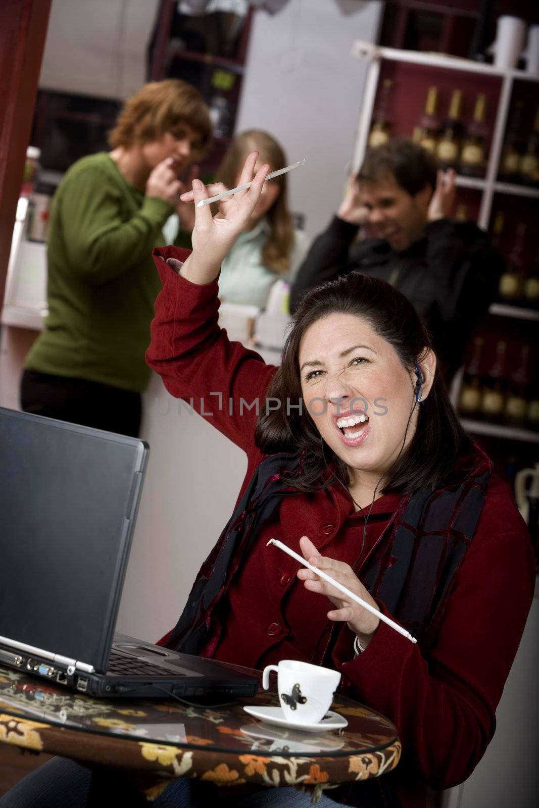 Obnoxious young woman singing loudly in a coffee house