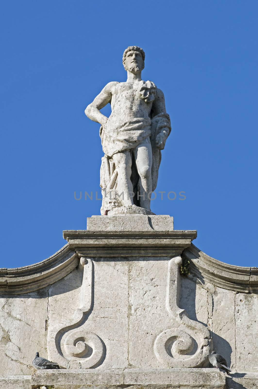 Statue on a building rooftop