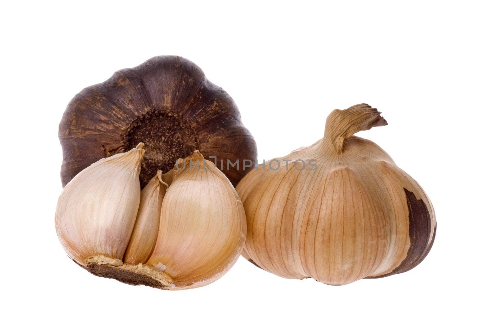 Isolated macro image of smoked garlic.