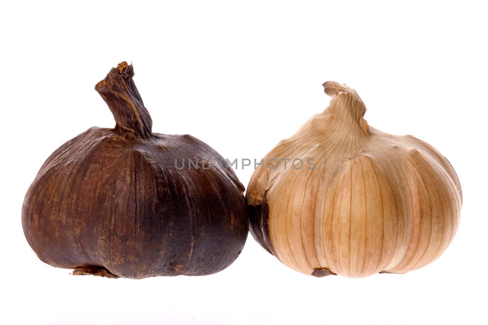 Isolated macro image of smoked garlic.