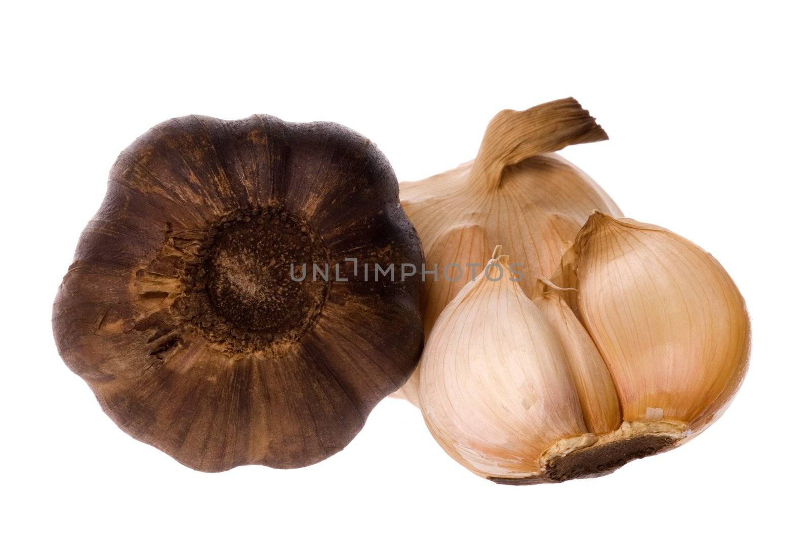 Isolated macro image of smoked garlic.