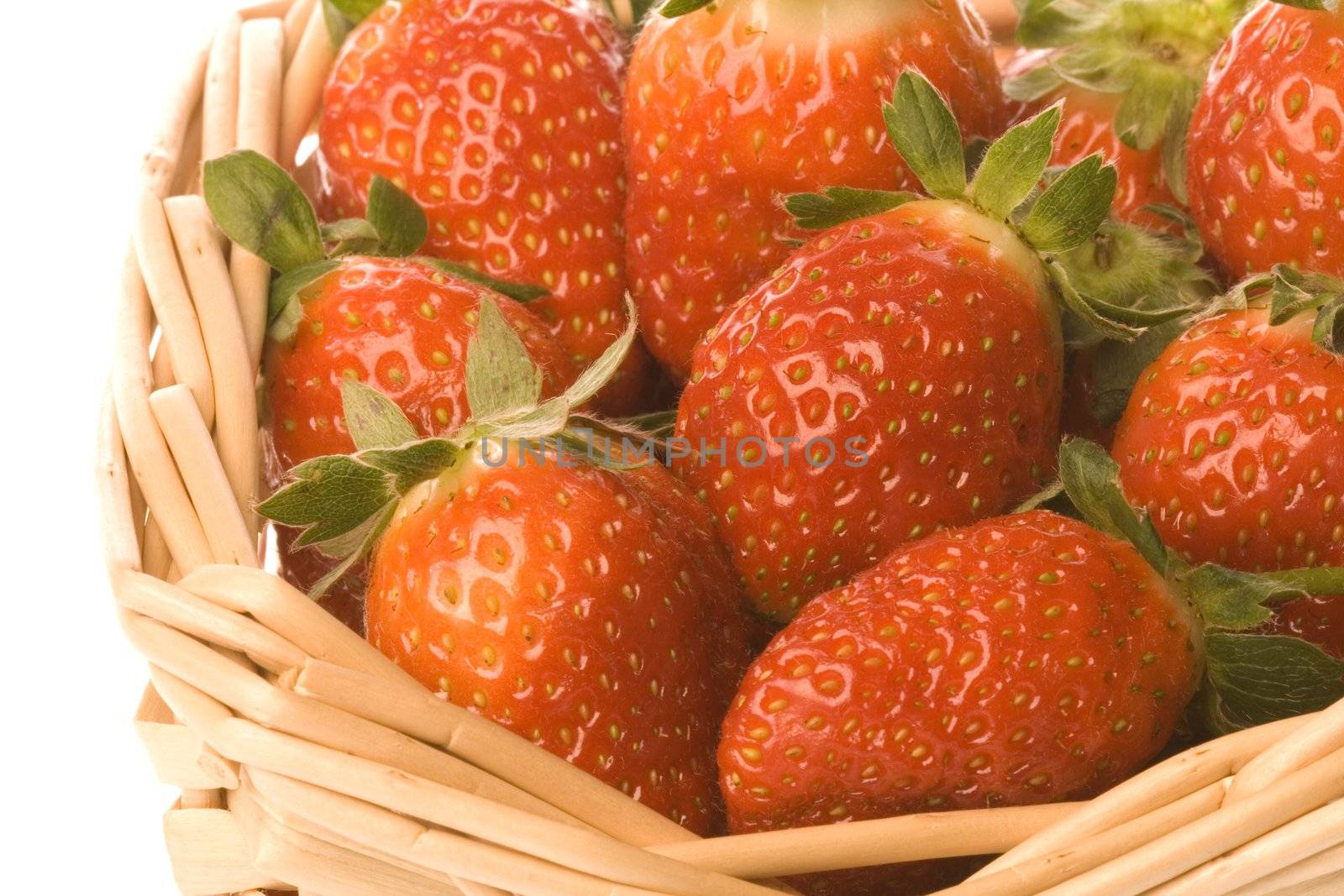 Isolated macro image of strawberries.