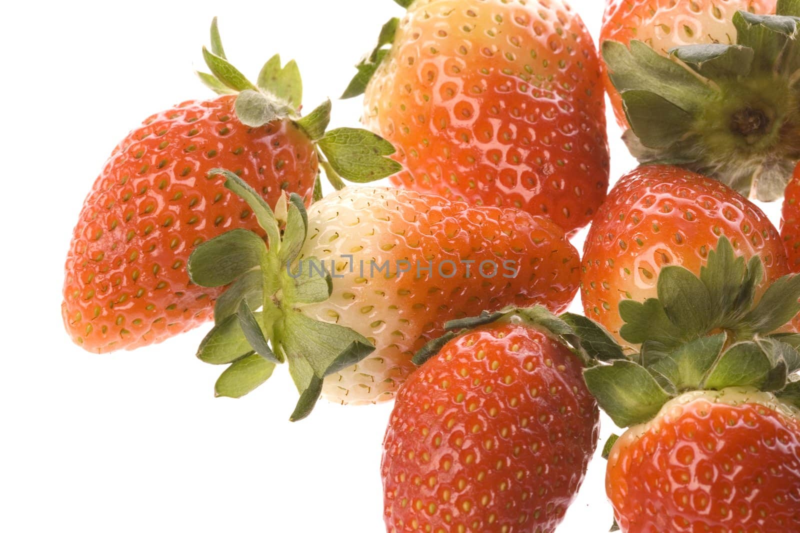 Isolated macro image of strawberries.