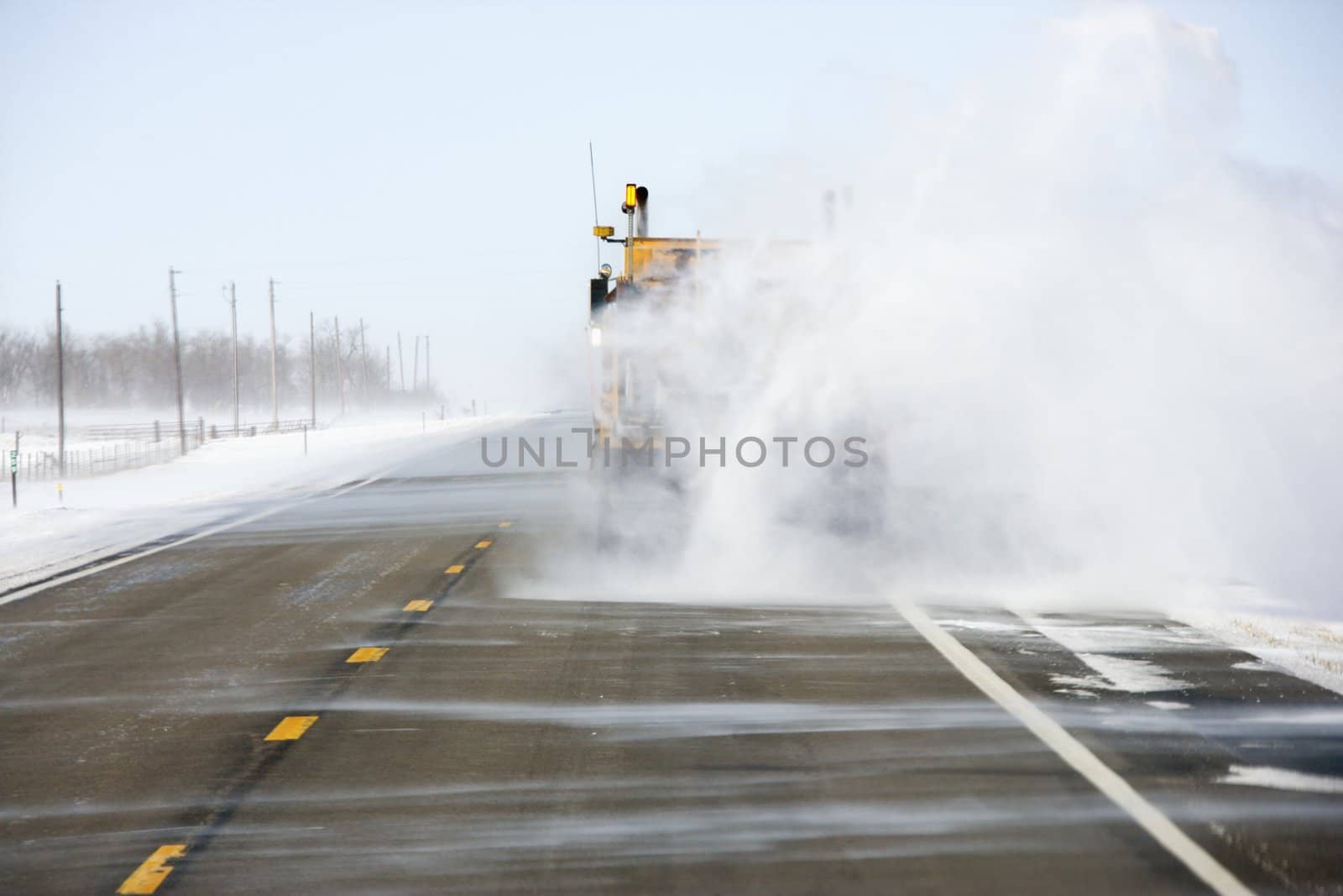 Truck with snow on road. by iofoto