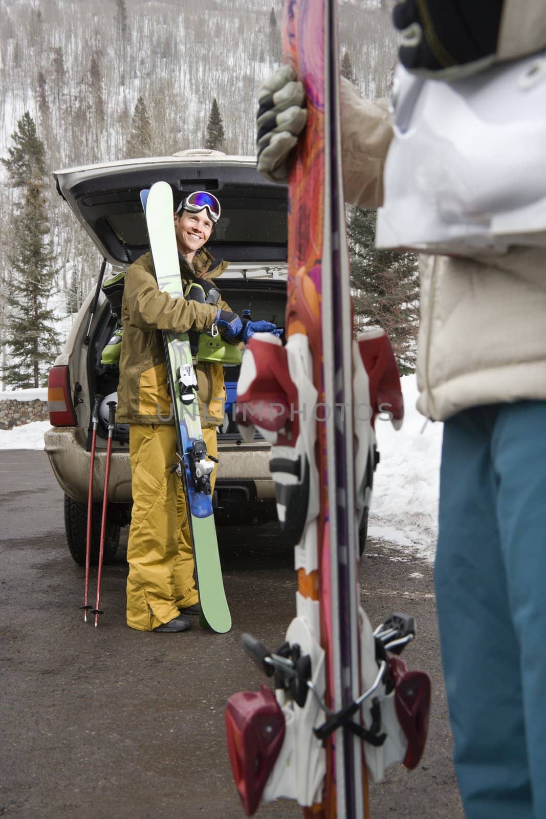 Couple going skiing. by iofoto