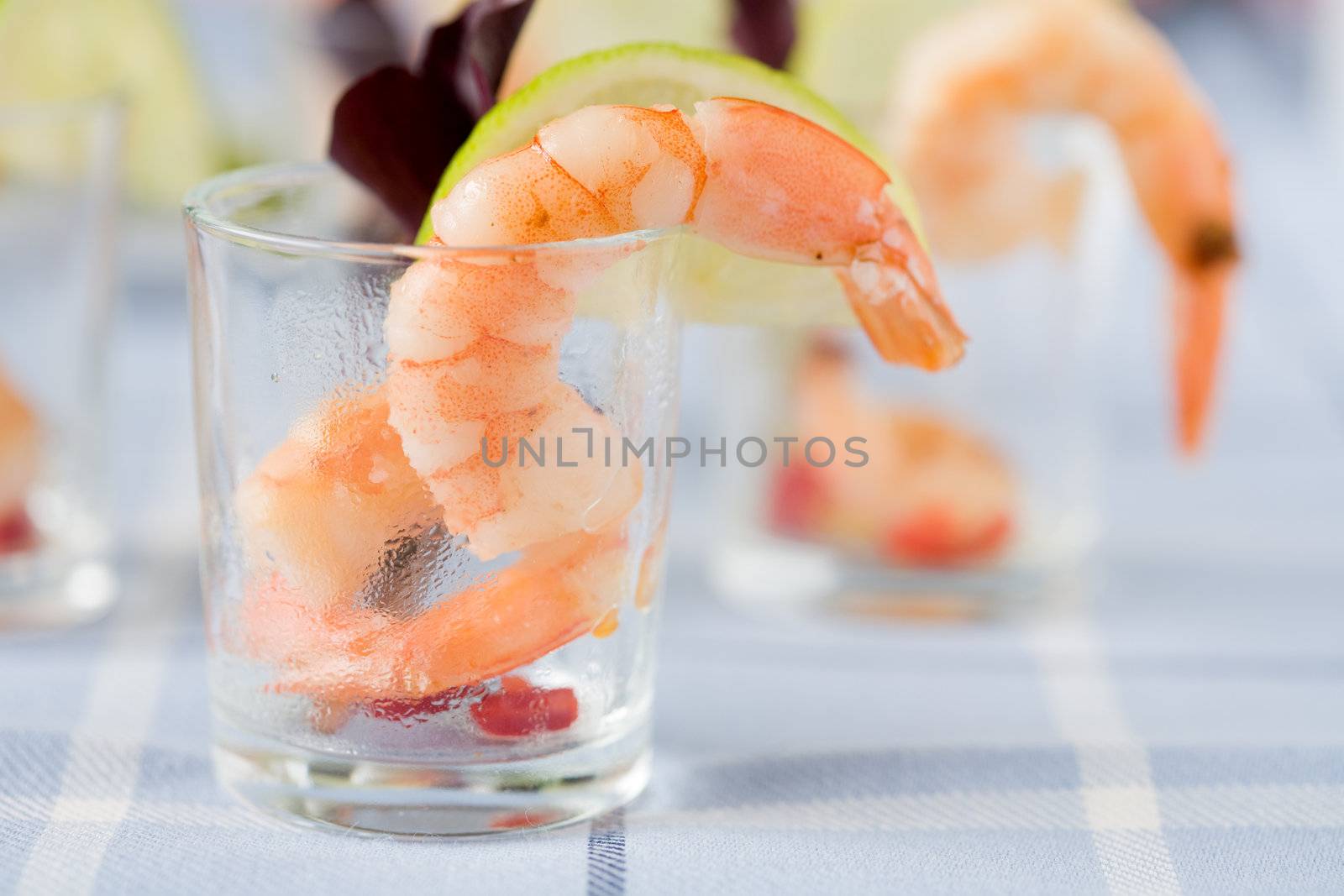 Delicious shrimp in small cocktailglass with lemon