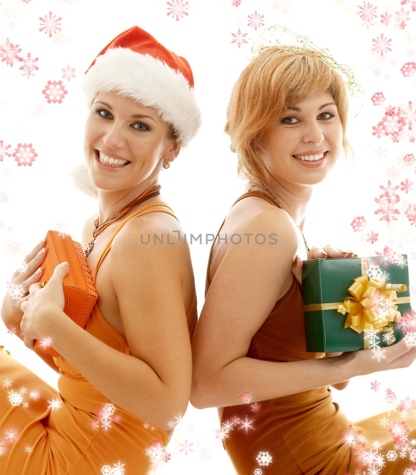 tho beauties celebrating christmas surrounded by rendered snowflakes