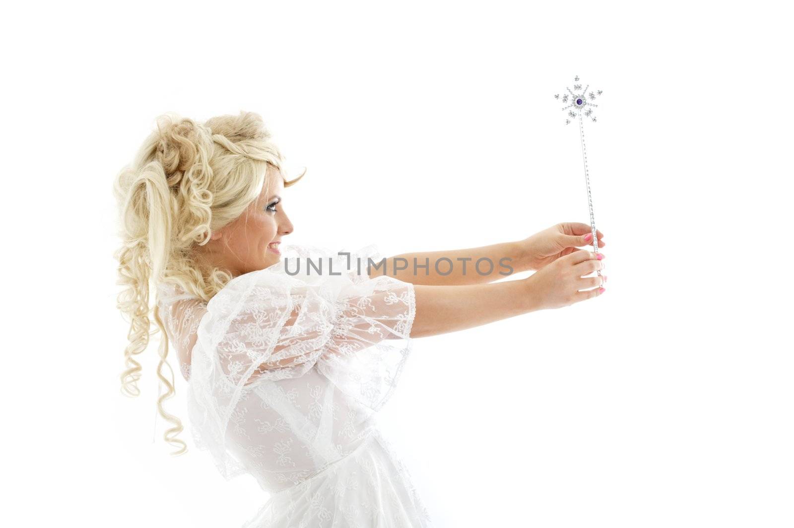 lovely blond in fairy dress with magic wand over white