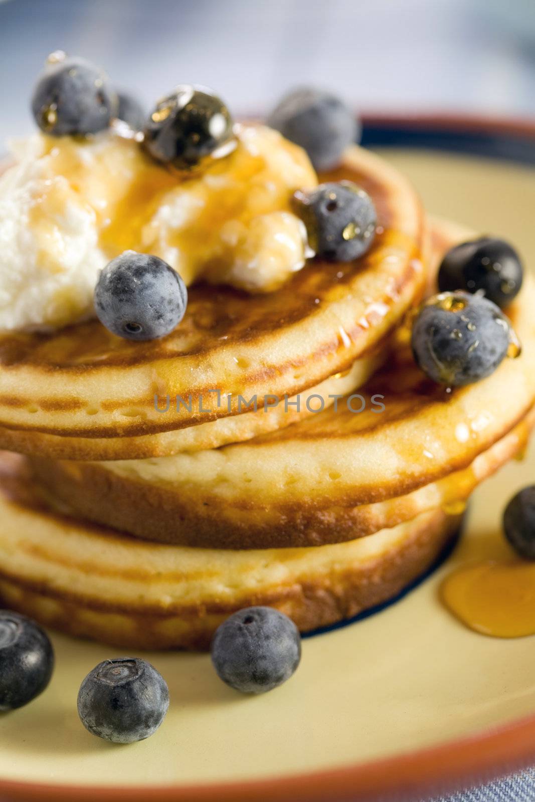 Delicious blueberry pancakes with honey