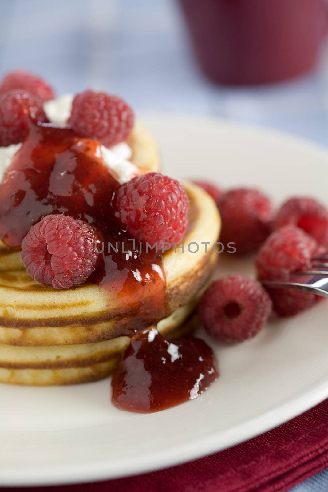 Delicious pancakes with raspberries and jelly