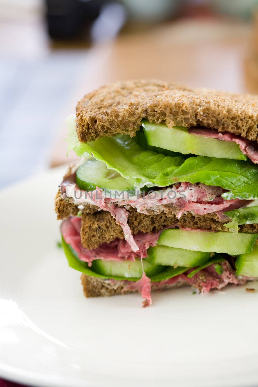 Healthy double sandwich cut with roastbeef and lettuce