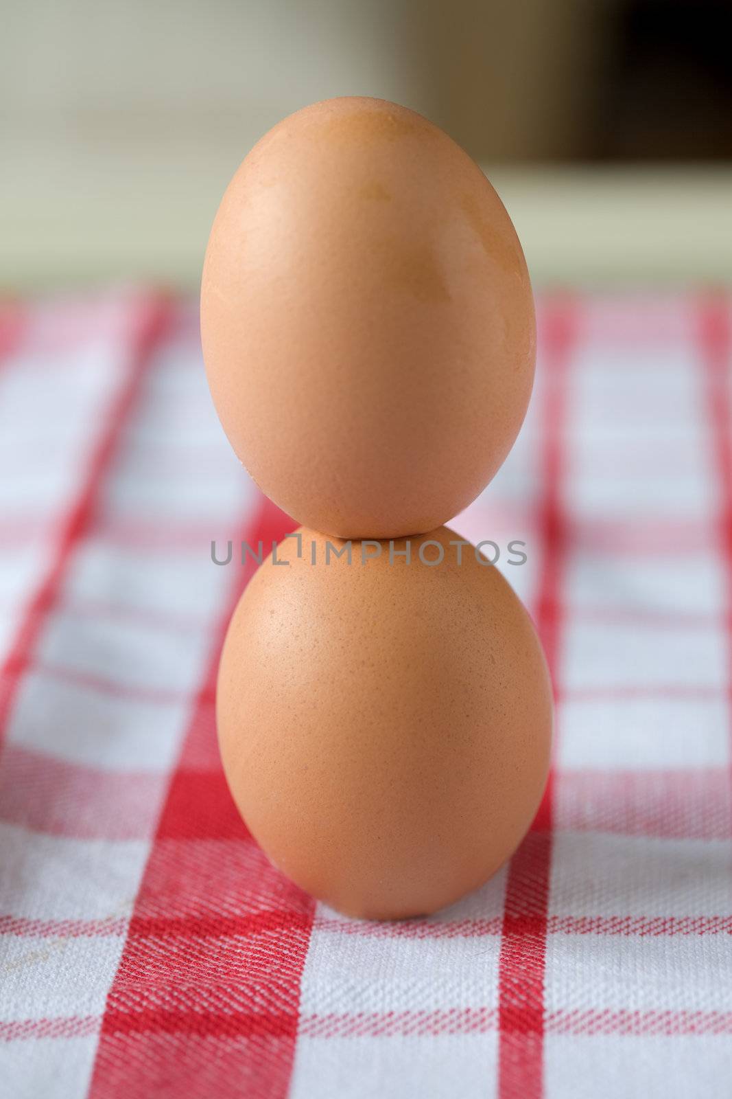 Two eggs standing on top of each other