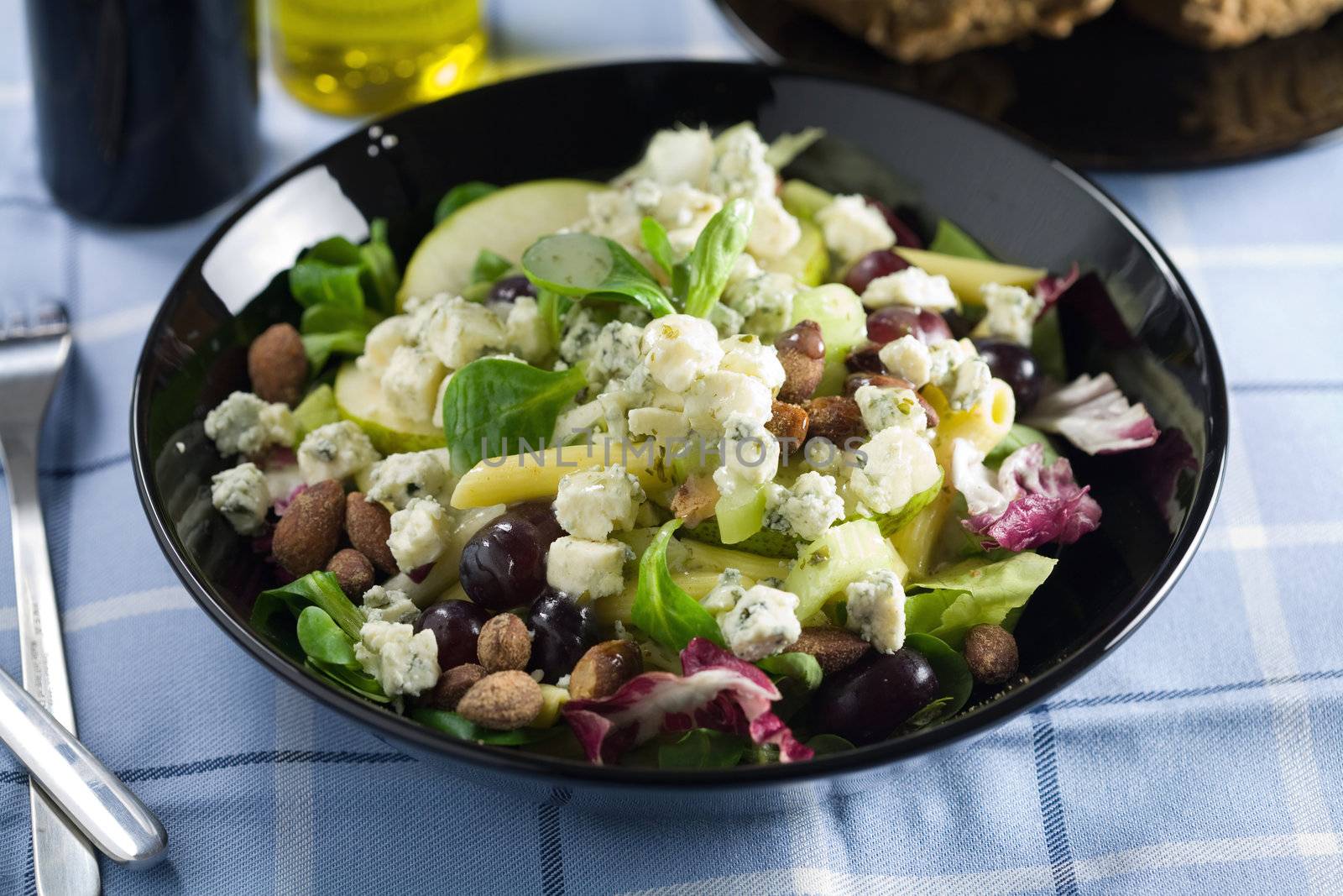 Delicious and healthy green salad with roquefort and grapes