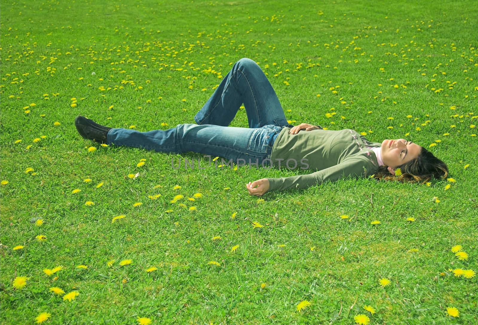 Young woman sleeping on the grass