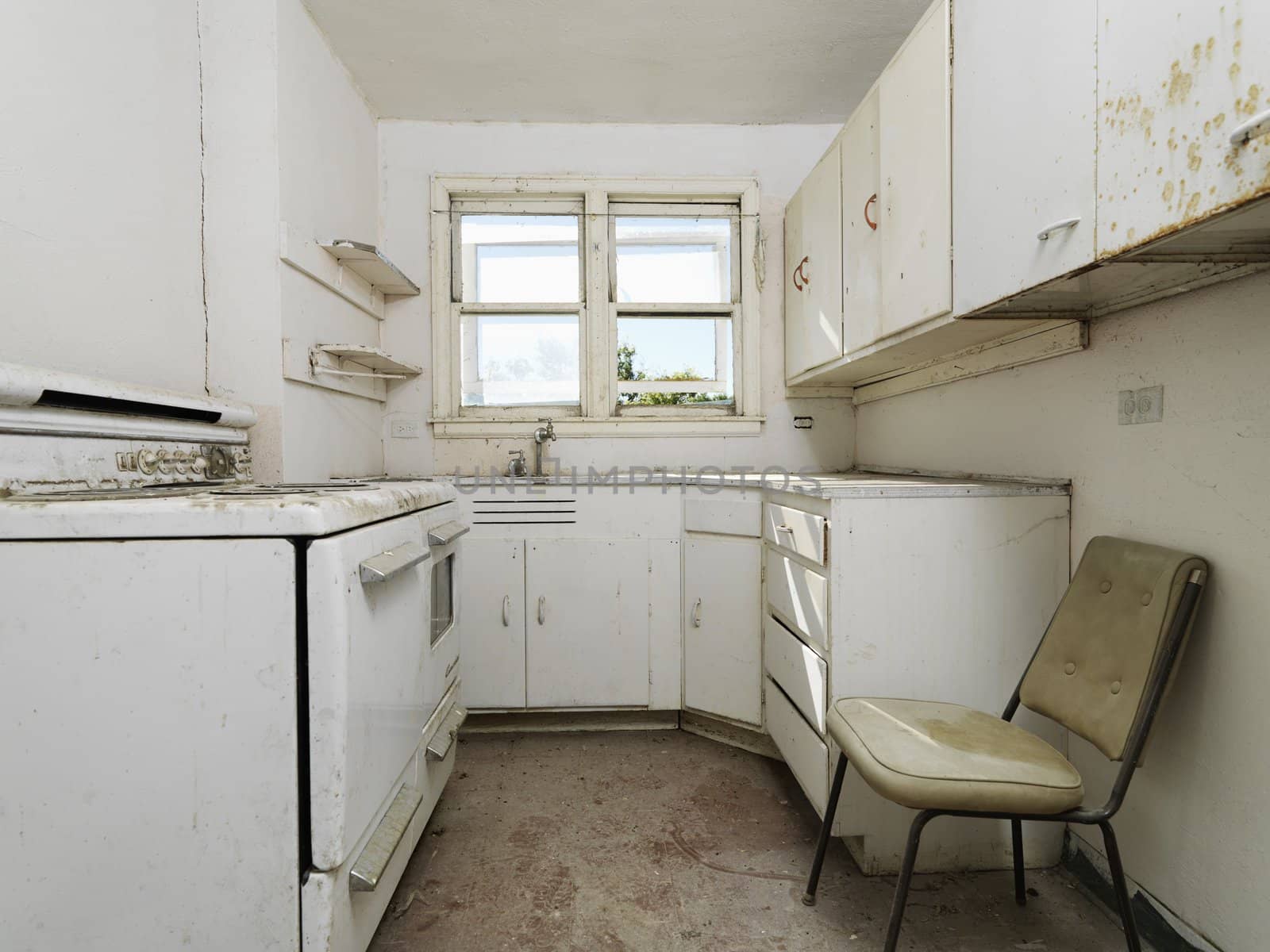 Forgotten empty abandoned dirty kitchen.