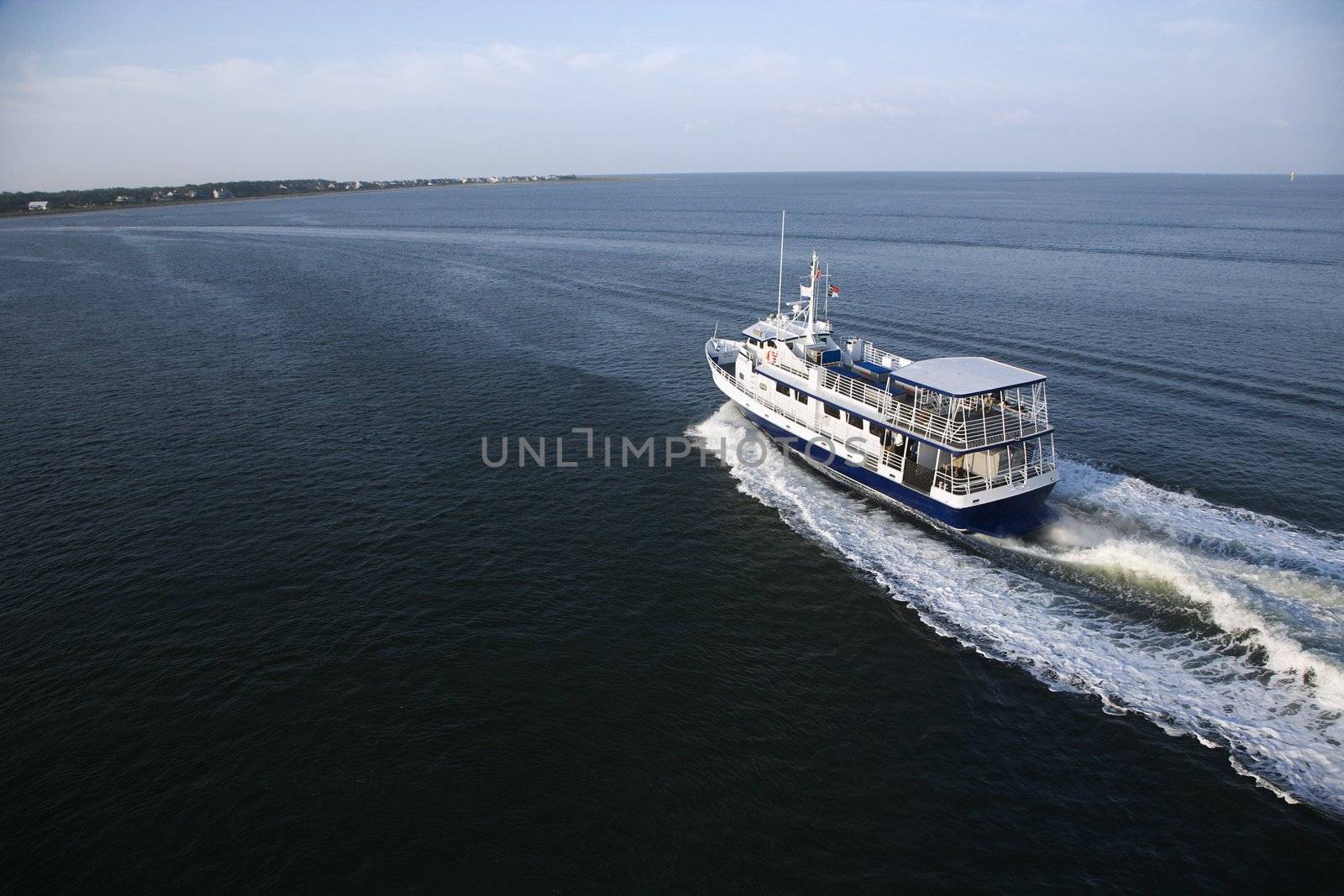 Ferry boat transporting passengers across Atlantic Ocean near Bald Head Island, North Carolina.