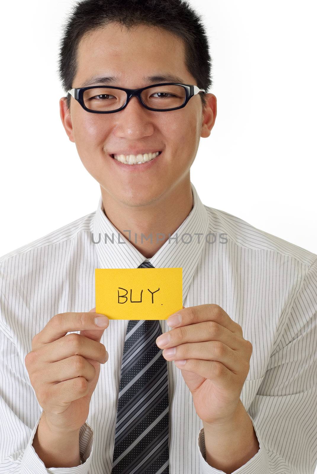 Shopping business man holding card written buy words and smiling.