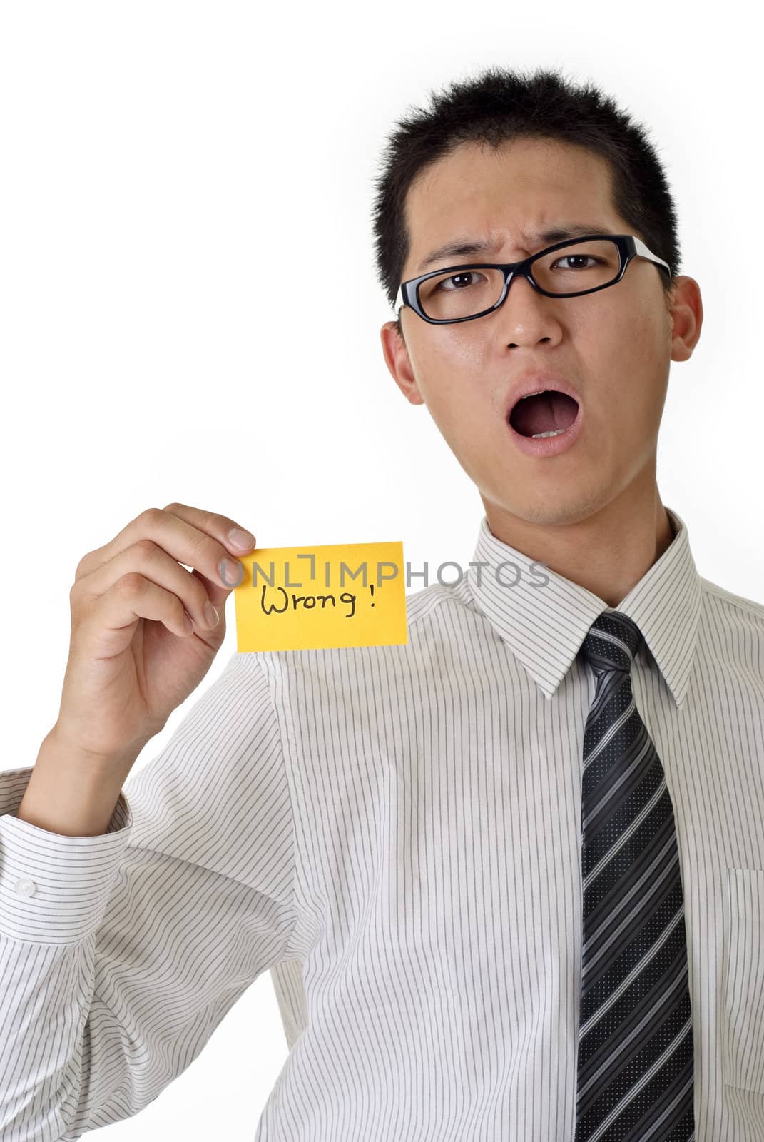 Business man say wrong and hold yellow card, closeup portrait of Asian with angry expression on white background.