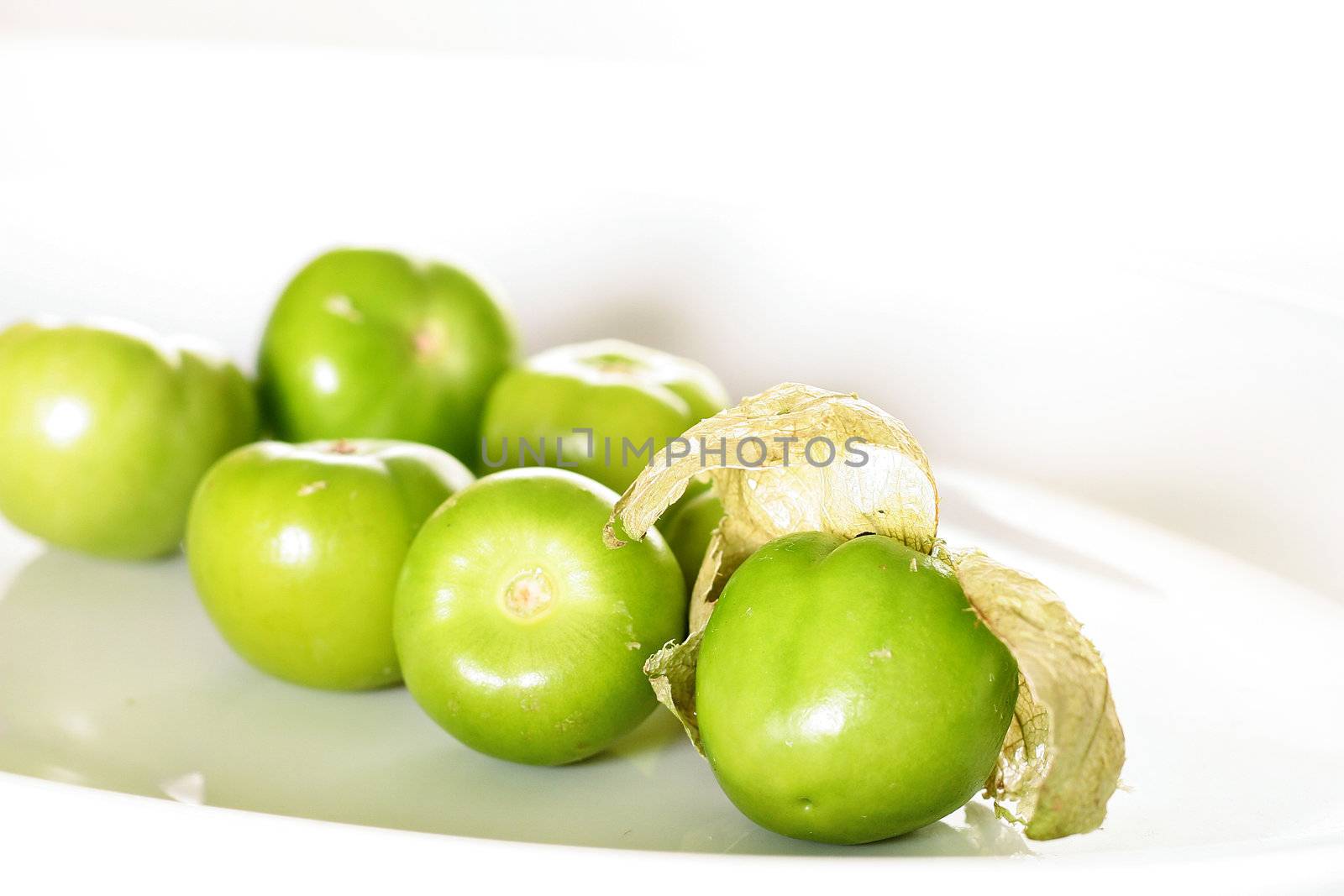 shot of tomatillos on white by creativestock