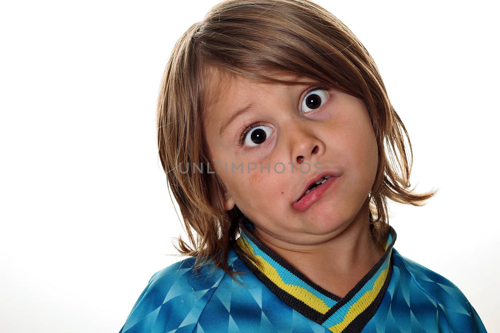 shot of a funny face little boy by creativestock