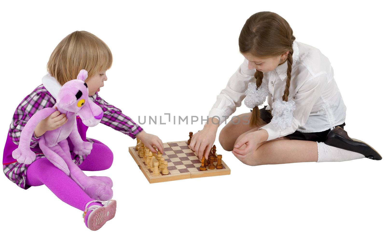 Children play chess on the white background