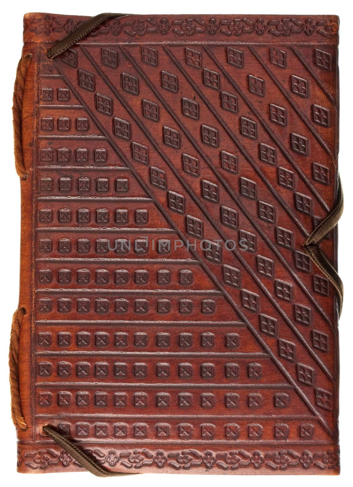 diary or scrapbook in a red stamped leather with geometrical pattern  ornaments isolated on white