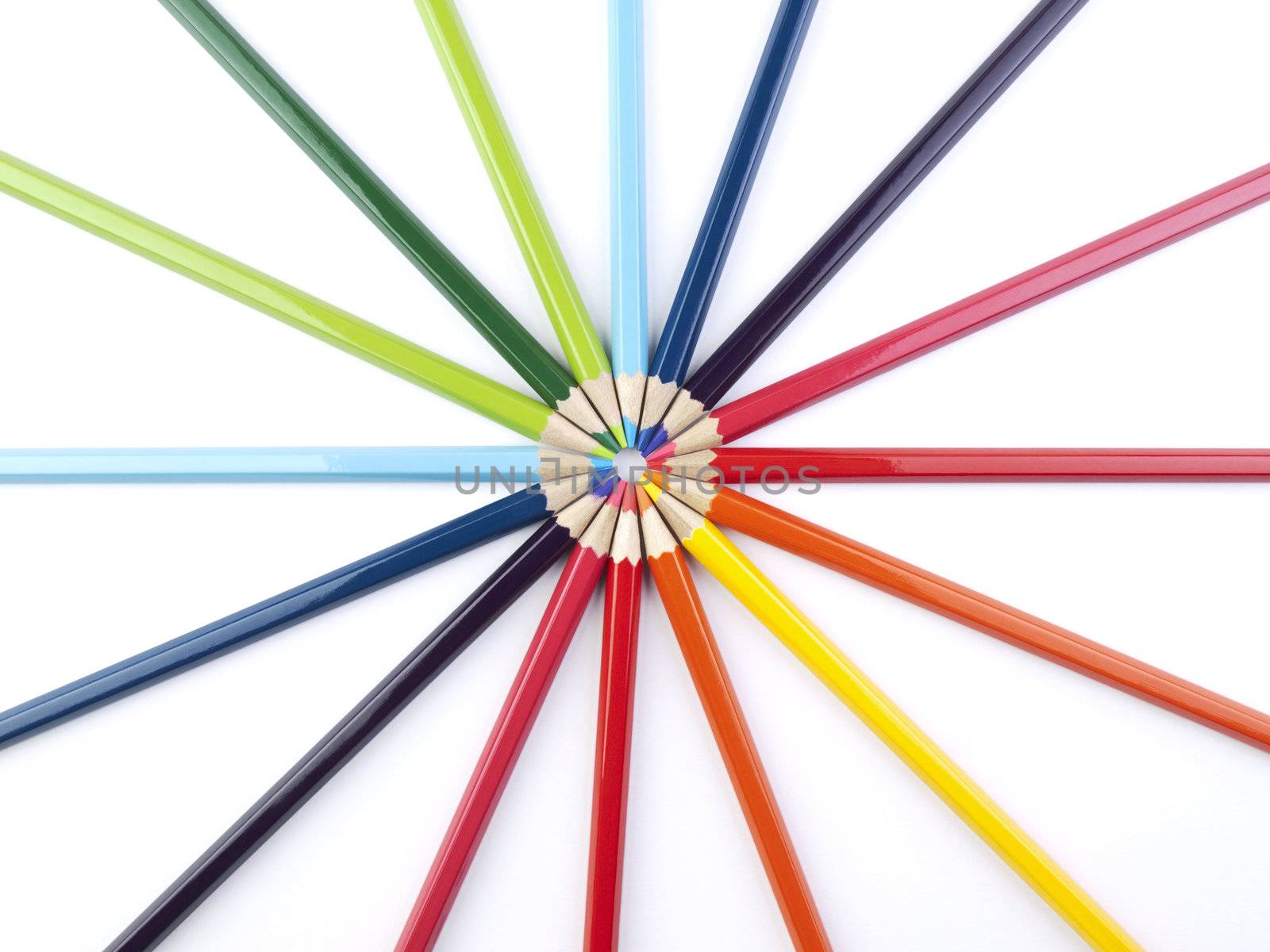 A circle formed by the points of several colored pencils.