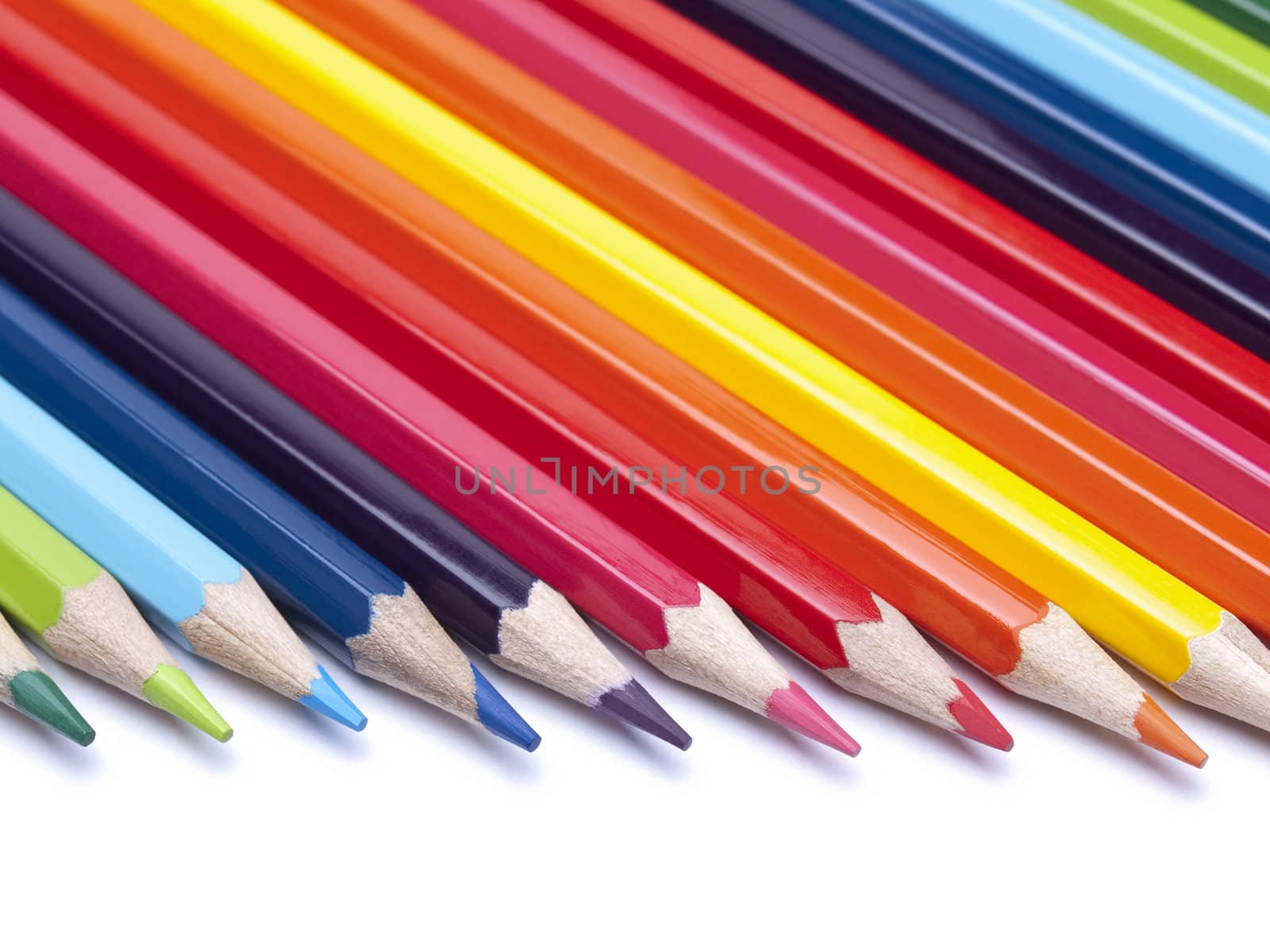 Colored pencils in formation pointing to the right.