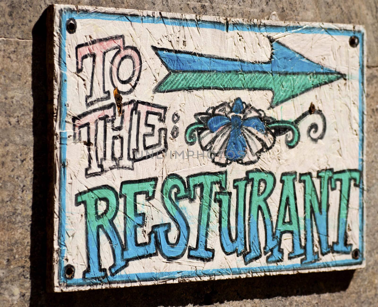A sign showing the way to the restaurant