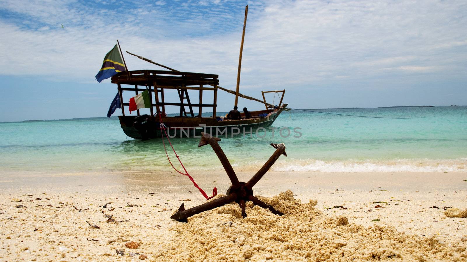 A fishing boat anchored by the beach in Zanzibar