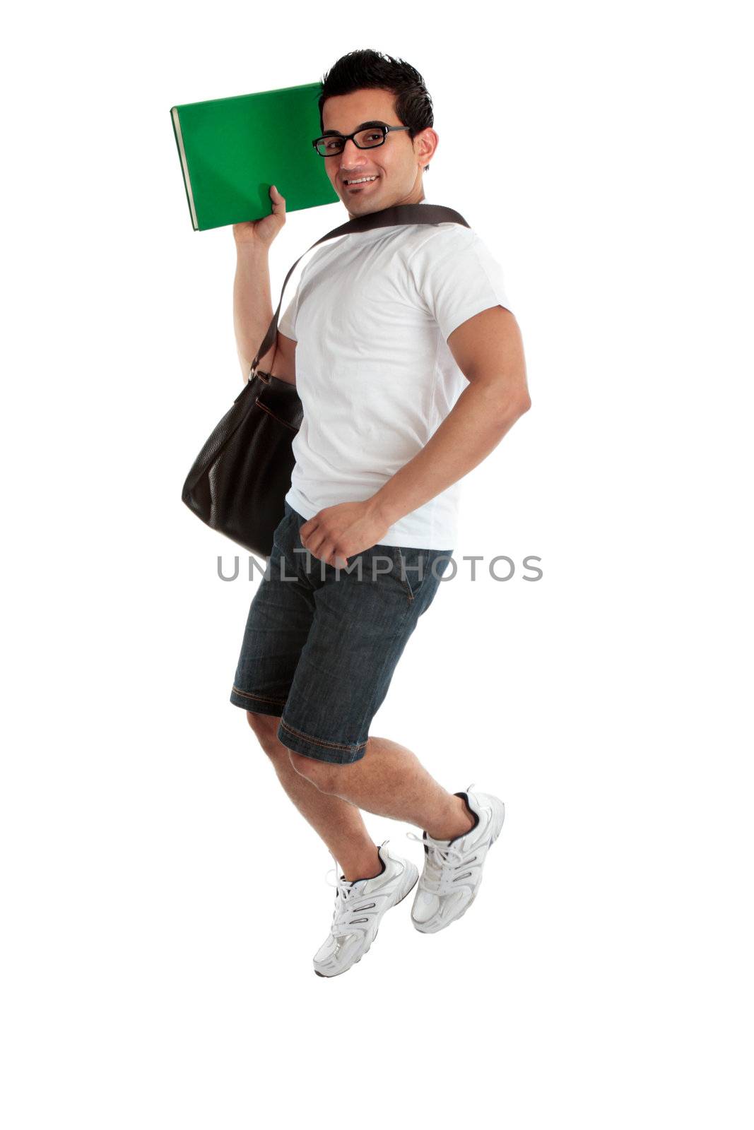 A happy smiling energetic jumping college student holding a book or textbook.  White background.