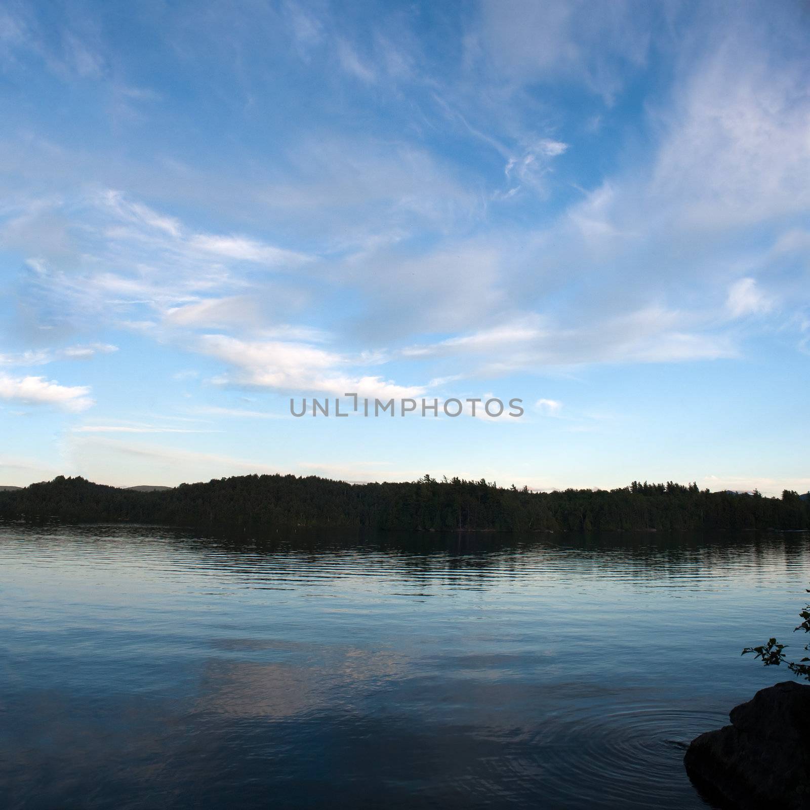 A view of lower Saranac Lake and islands located in the upstate New York Adirondacks around dusk.