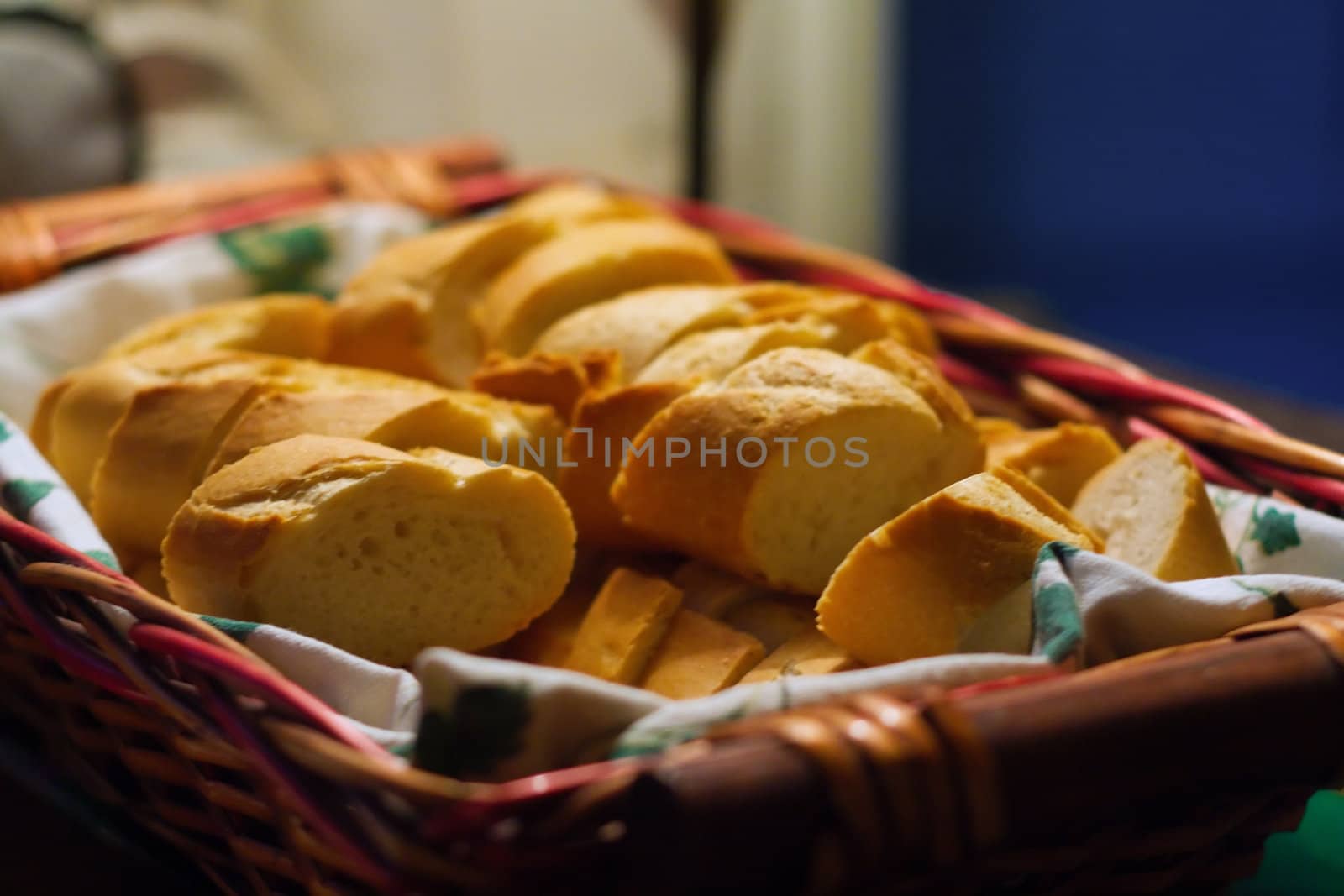 Basket of sliced bread with piece of cloth in the basket