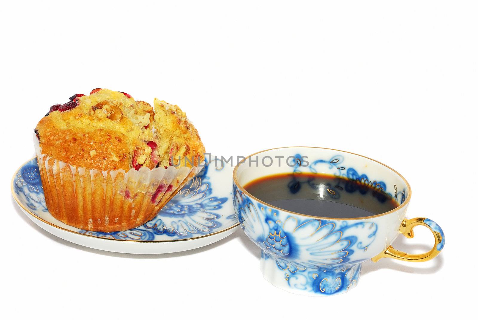 Luxor blue coffee cup with cranberry muffin  isolated on the white.