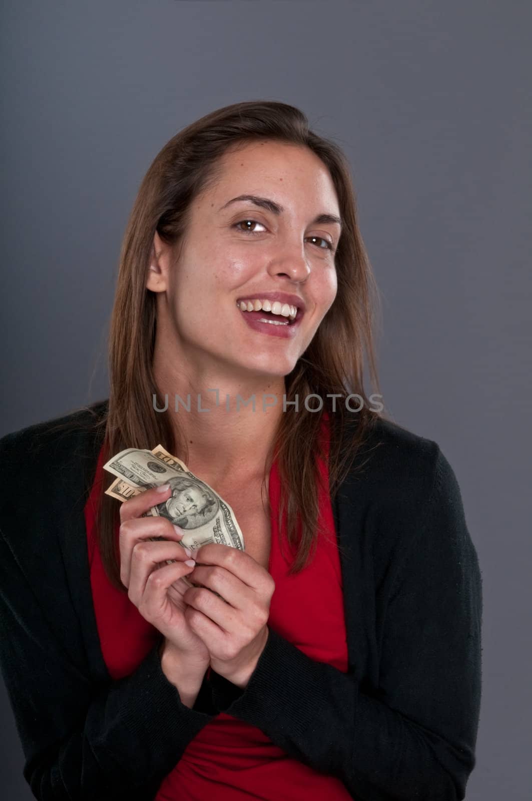 Young Caucasian woman happy after receiving some money