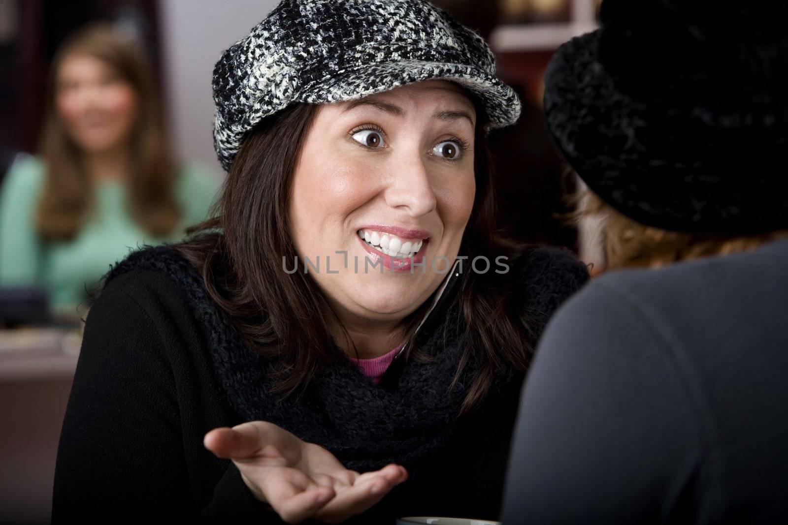 Pretty Hispanic woman with coffee and a big smile