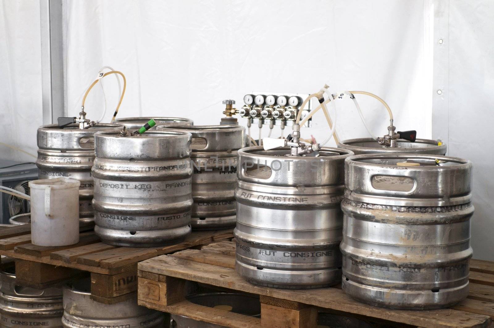 Steel indutrial barrels of beer stocked in storage