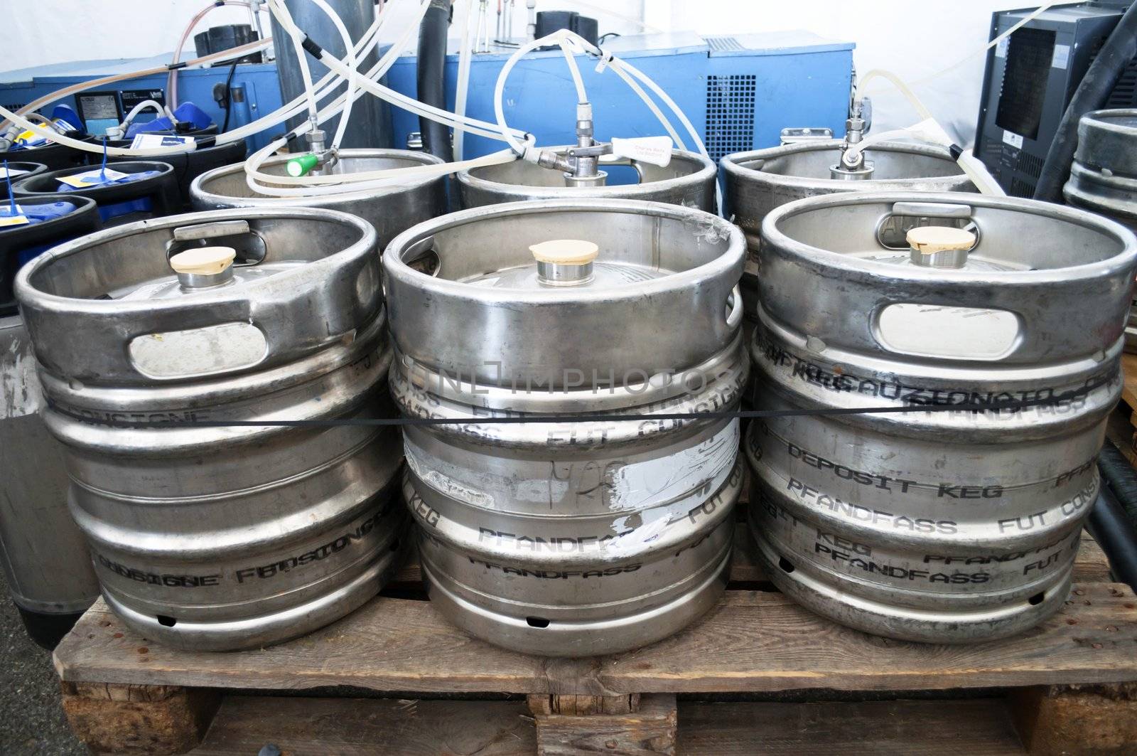 Steel indutrial barrels of beer stocked in storage