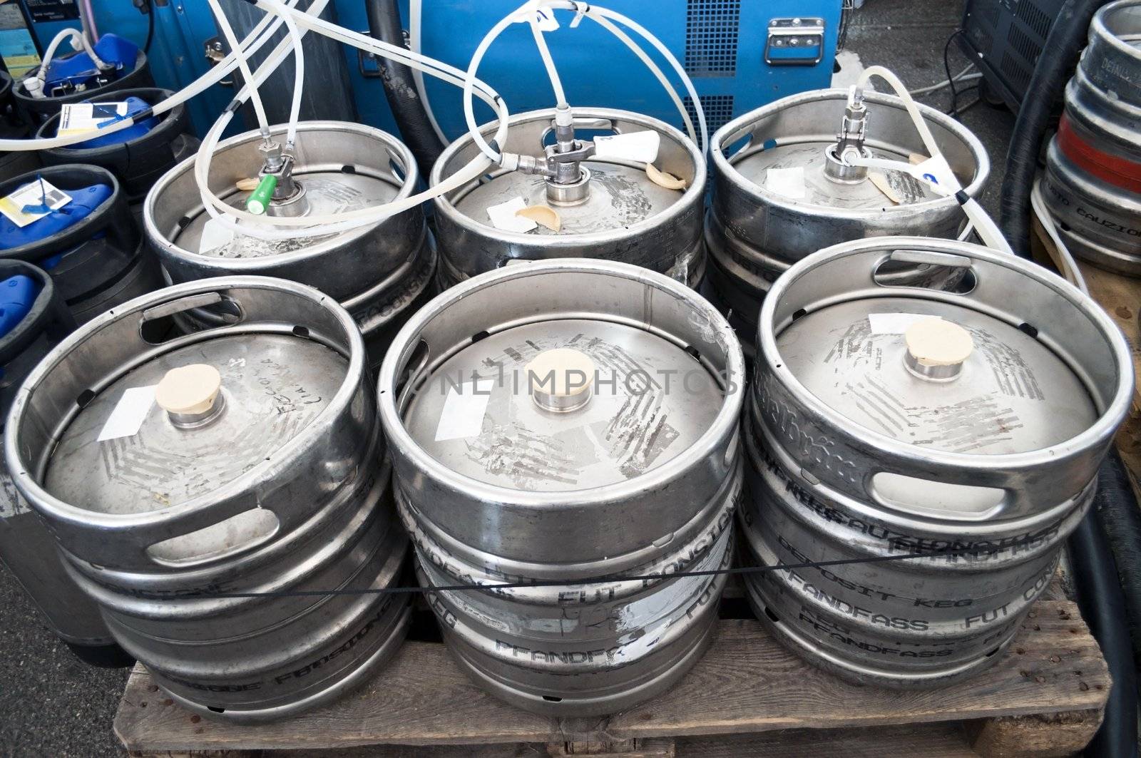 Steel indutrial barrels of beer stocked in storage