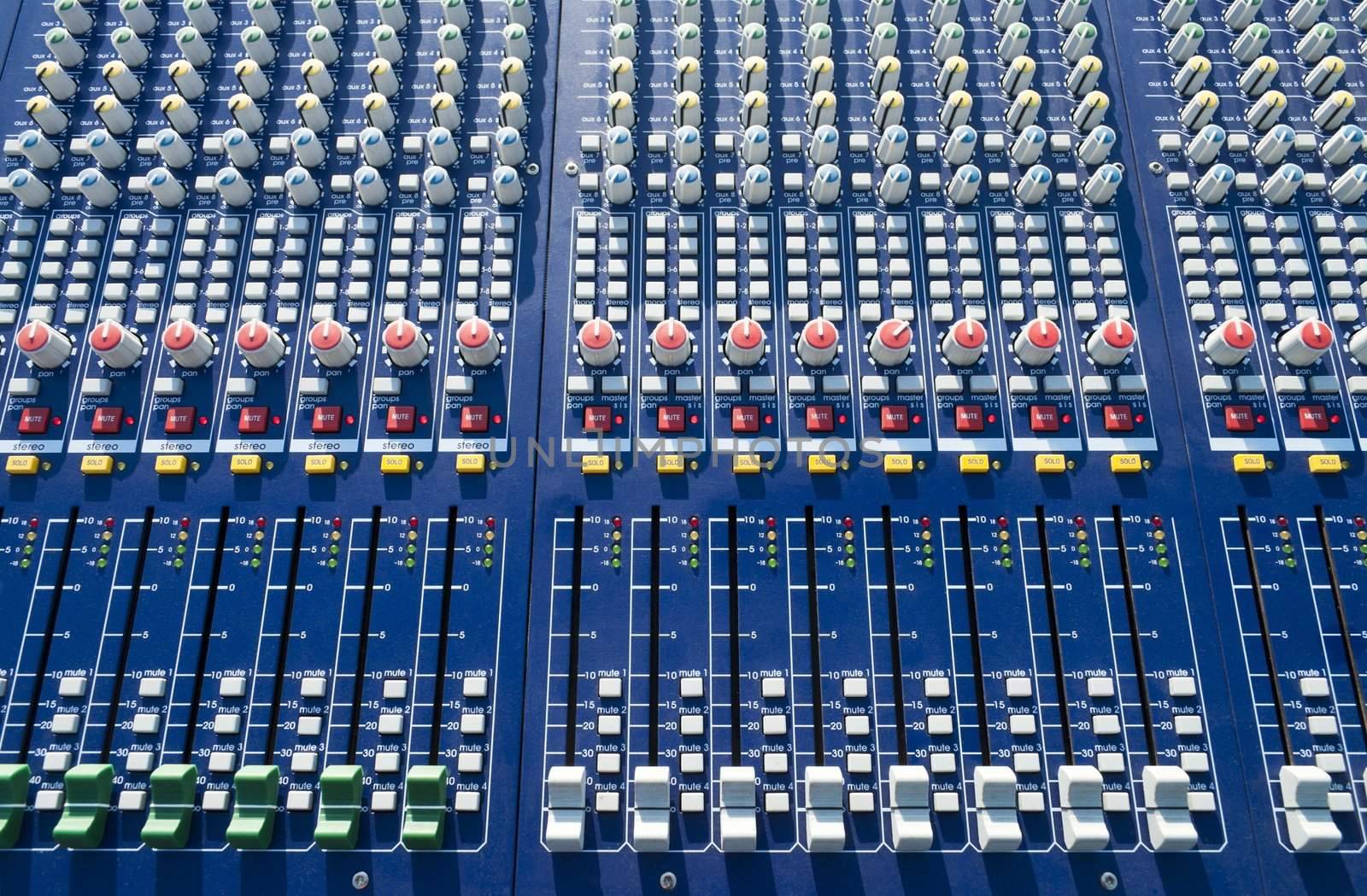 big mixer console in a concert stage