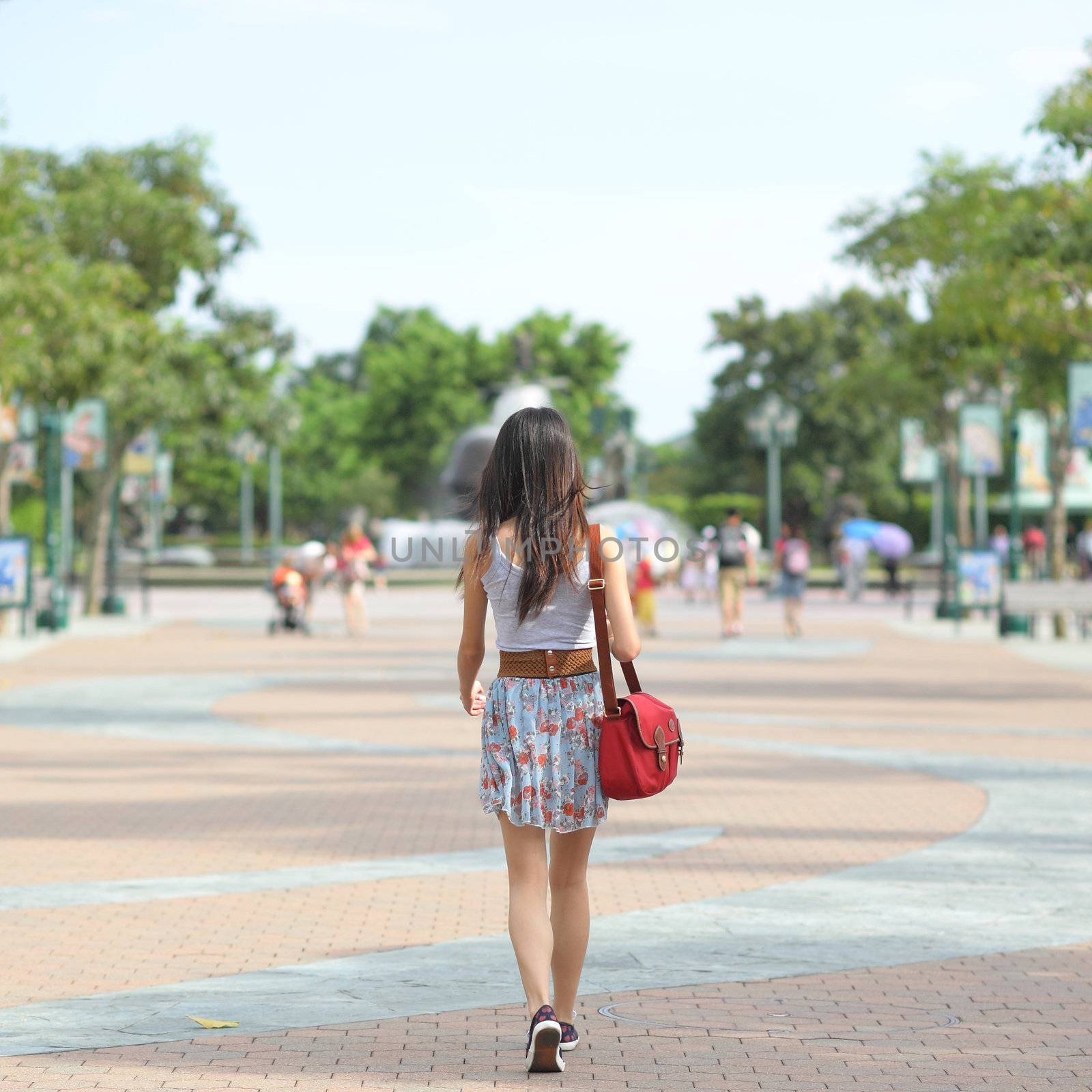 fashion girl walking on street with soft color tone by leungchopan