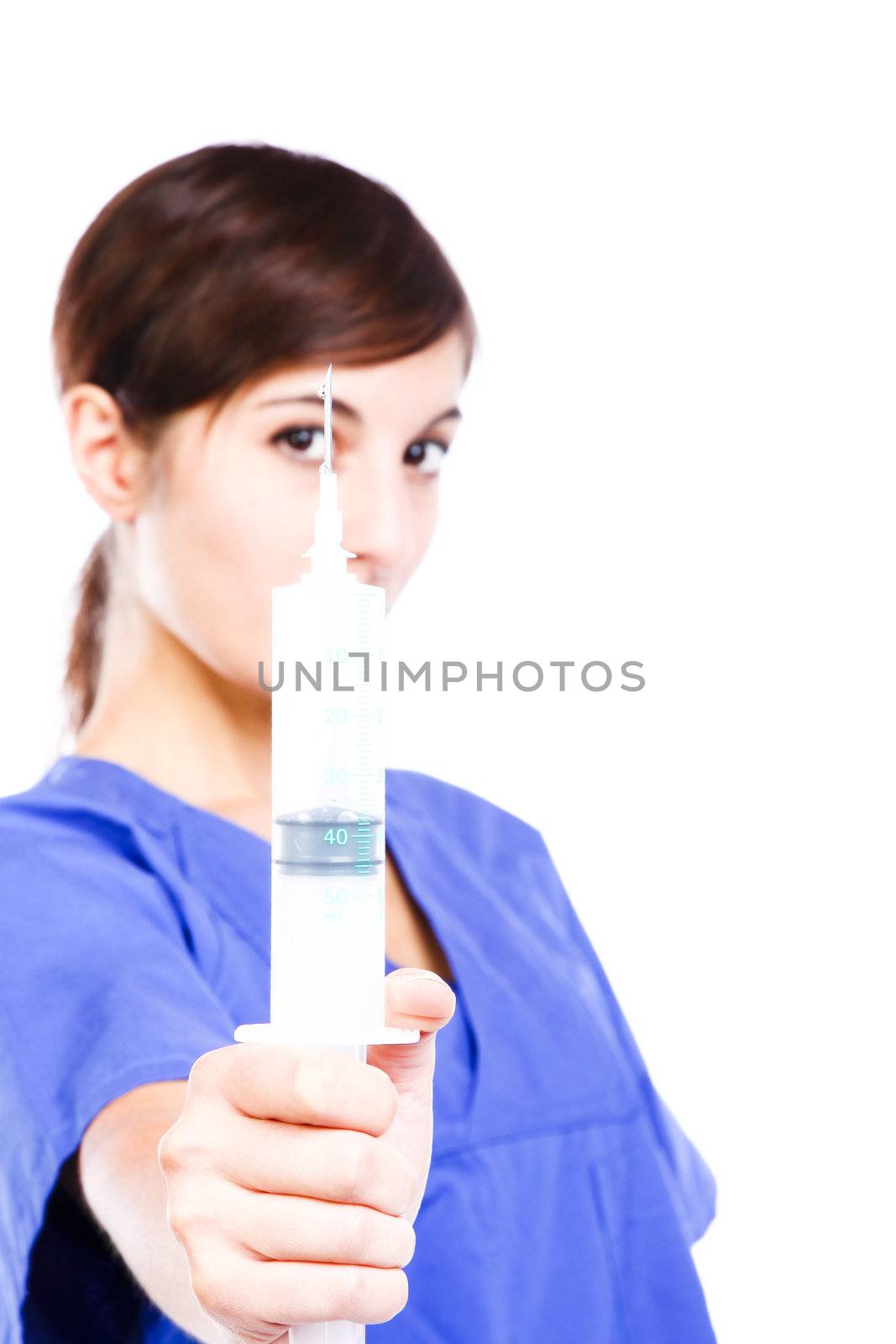 Conceptual Photo Of A Young Nurse Showing A Syringe