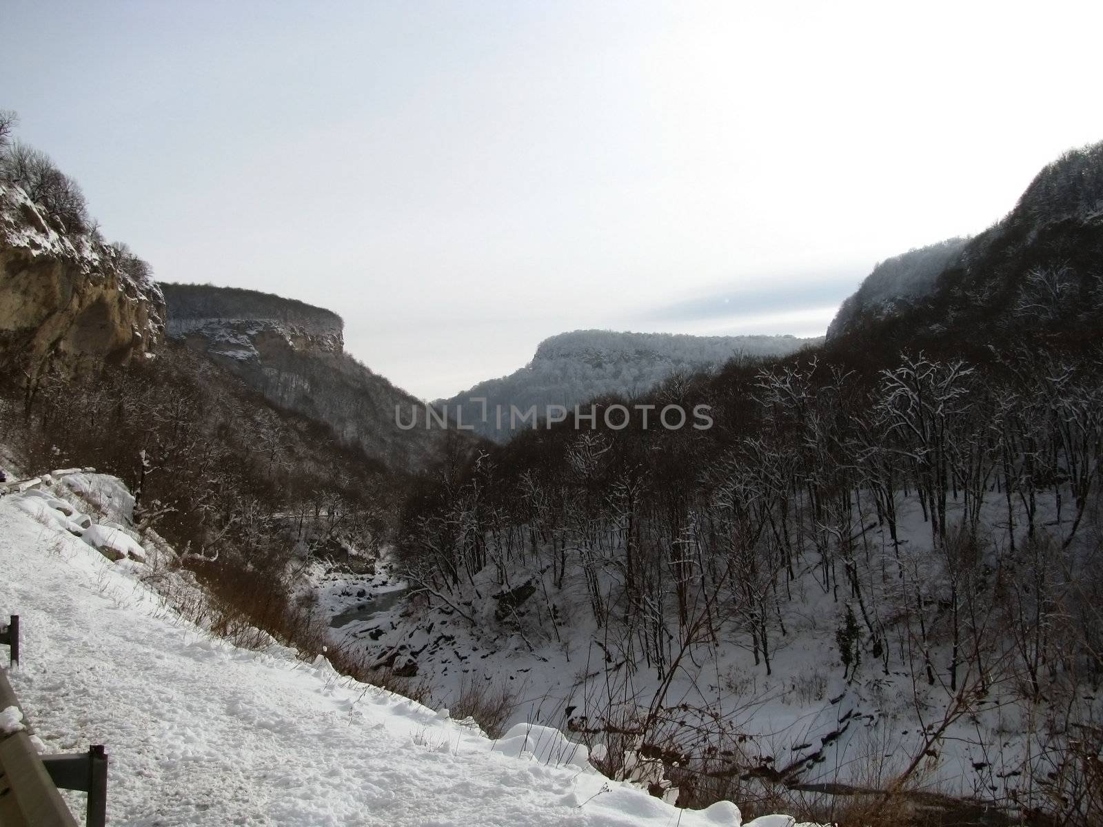 Canyon, winter; gorge, wood, snow; relief, nature; landscape;  frost; journey; mountain type; sky; background; beauty; Caucasus, spine
