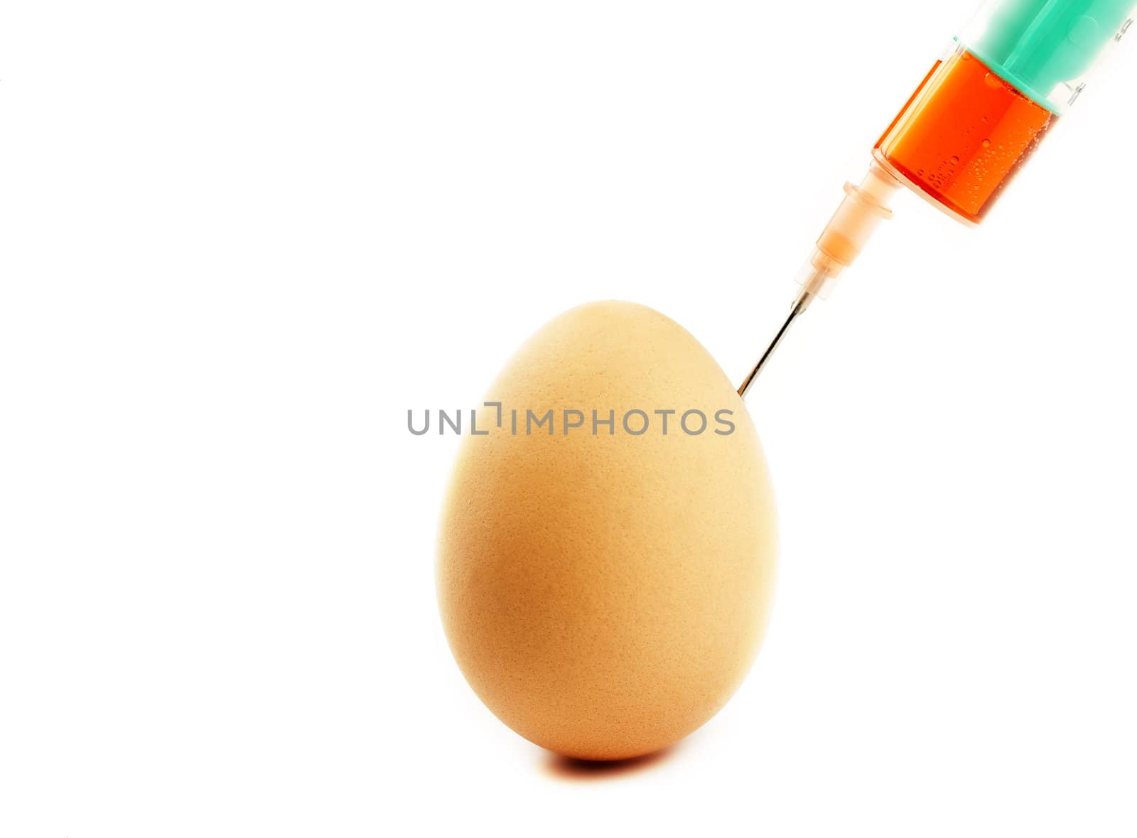 one egg gets injection from a syringe