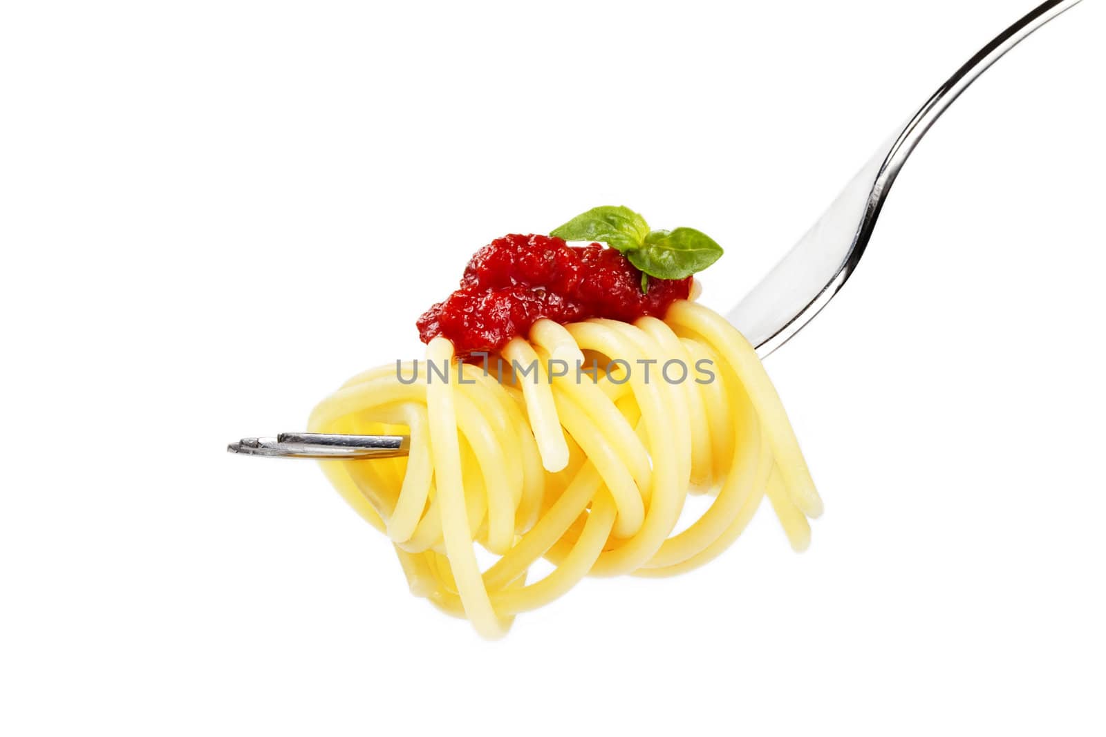 pasta with red sauce and basil on a fork on white background