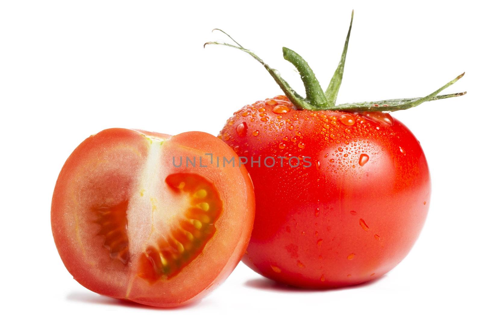 one tomato and a half on white background
